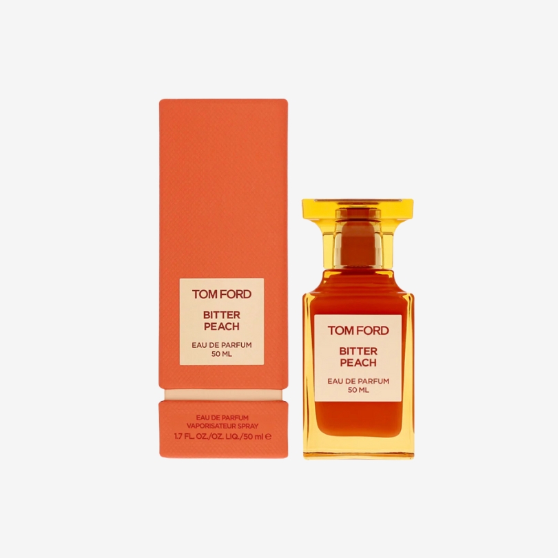 Tom Ford Bitter Peach perfume bottle in bold orange glass with luxurious gold accents