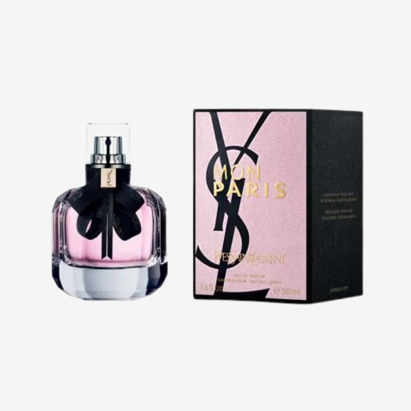 Mon Paris Eau de Parfum bottle by YSL with soft pink liquid and black ribbon detail