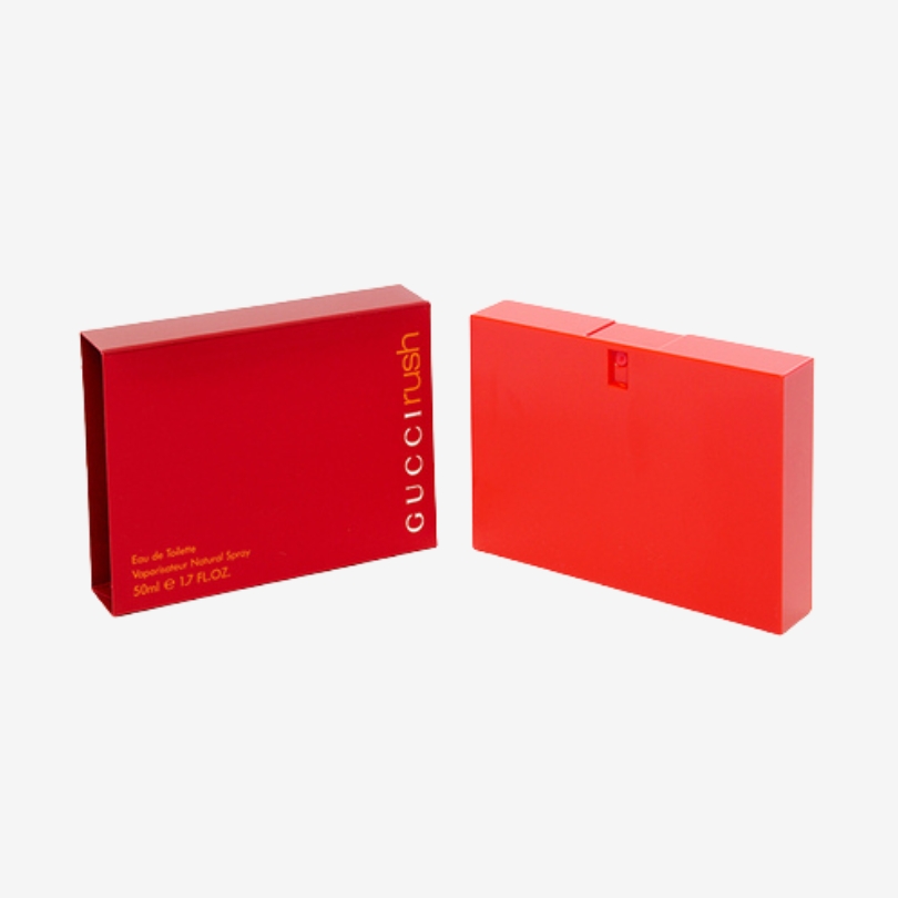 Gucci Rush perfume bottle in bold red square design with a modern and edgy look